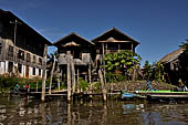 Inle Lake Myanmar. All the buildings are constructed on piles. Residents travel around by canoe, but there are also bamboo walkways and bridges over the canals, monasteries and stupas. 